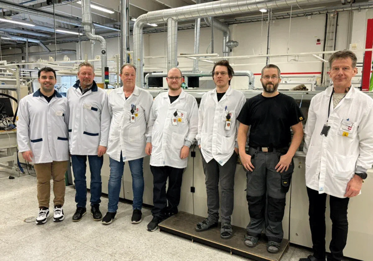 Blixt and Sanmina team members on the Sanmina manufacturing floor